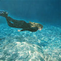 Painting of girl swimming underwater. (thumb)