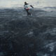 Painting of ice skater on black ice