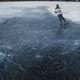 Painting of ice skater on black ice