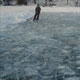 Painting of ice skater on blue ice