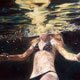 Painting of girl swimming underwater