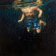 Painting of boy swimming underwater