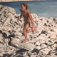 Painting of naked man running over rocks