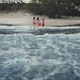 Painting of sandy beach with four kids
