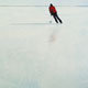 Painting of ice skating on a frozen lake