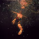Painting of swimmer in underwater galaxy